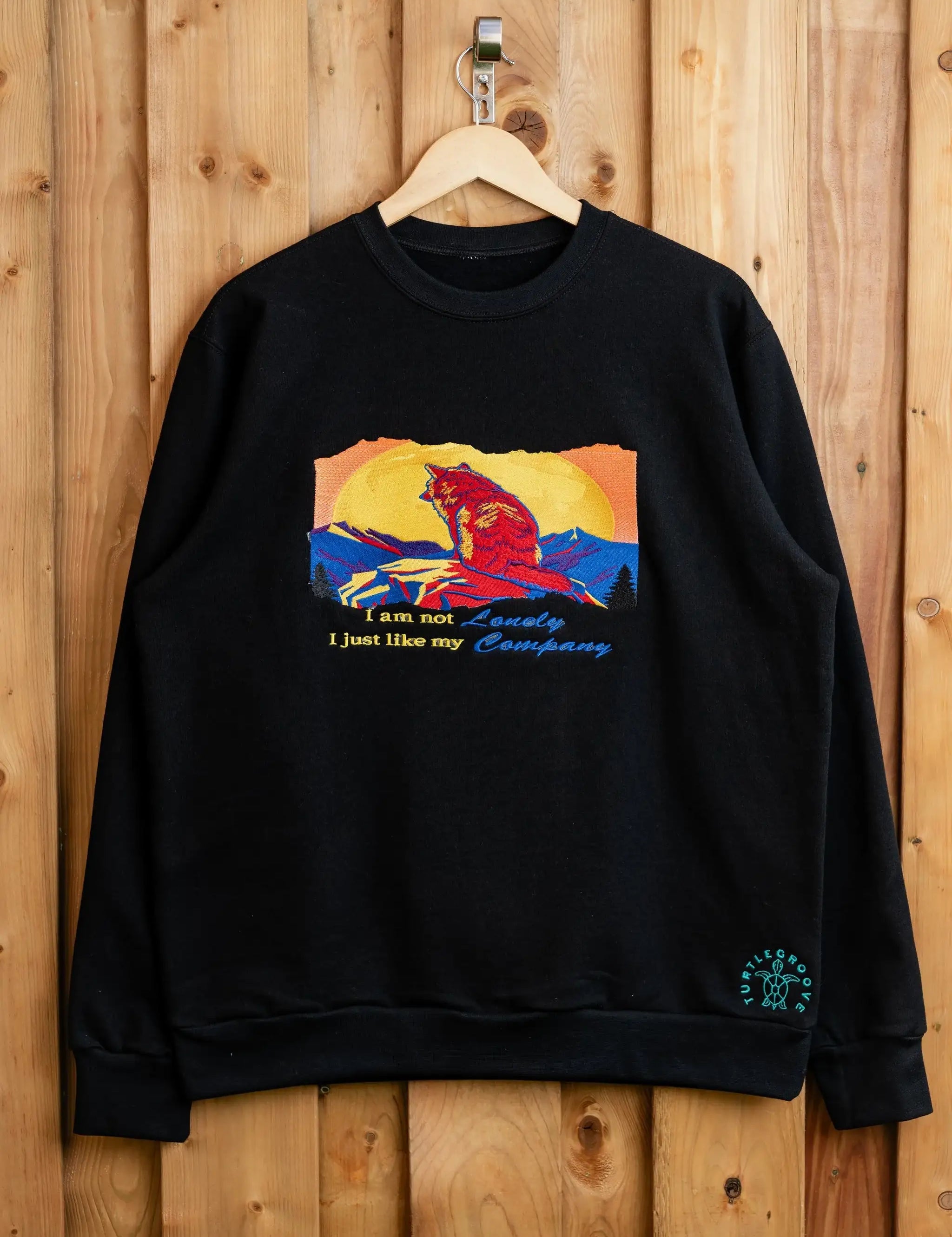 I Am Not Lonely embroidered sweatshirt by TURTLEGROOVE – front view, black