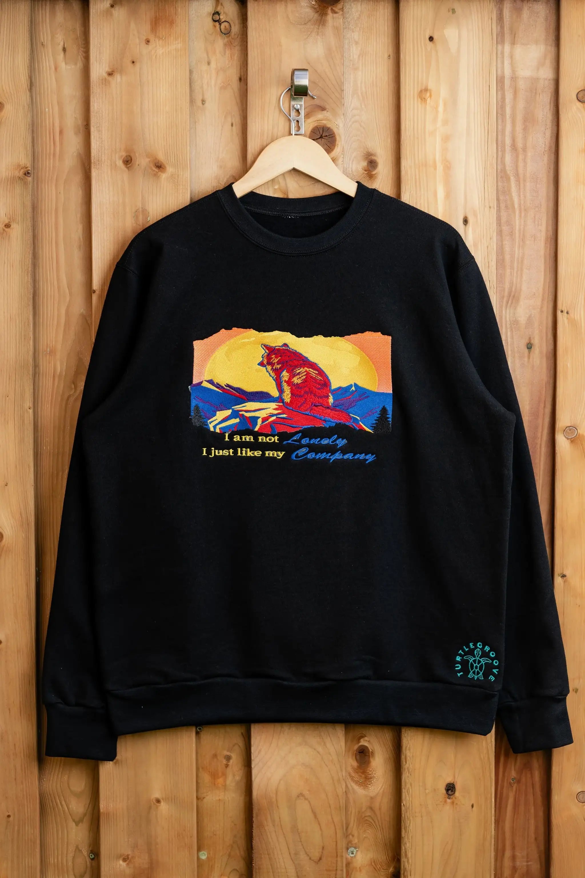 I Am Not Lonely embroidered sweatshirt by TURTLEGROOVE – front view, black