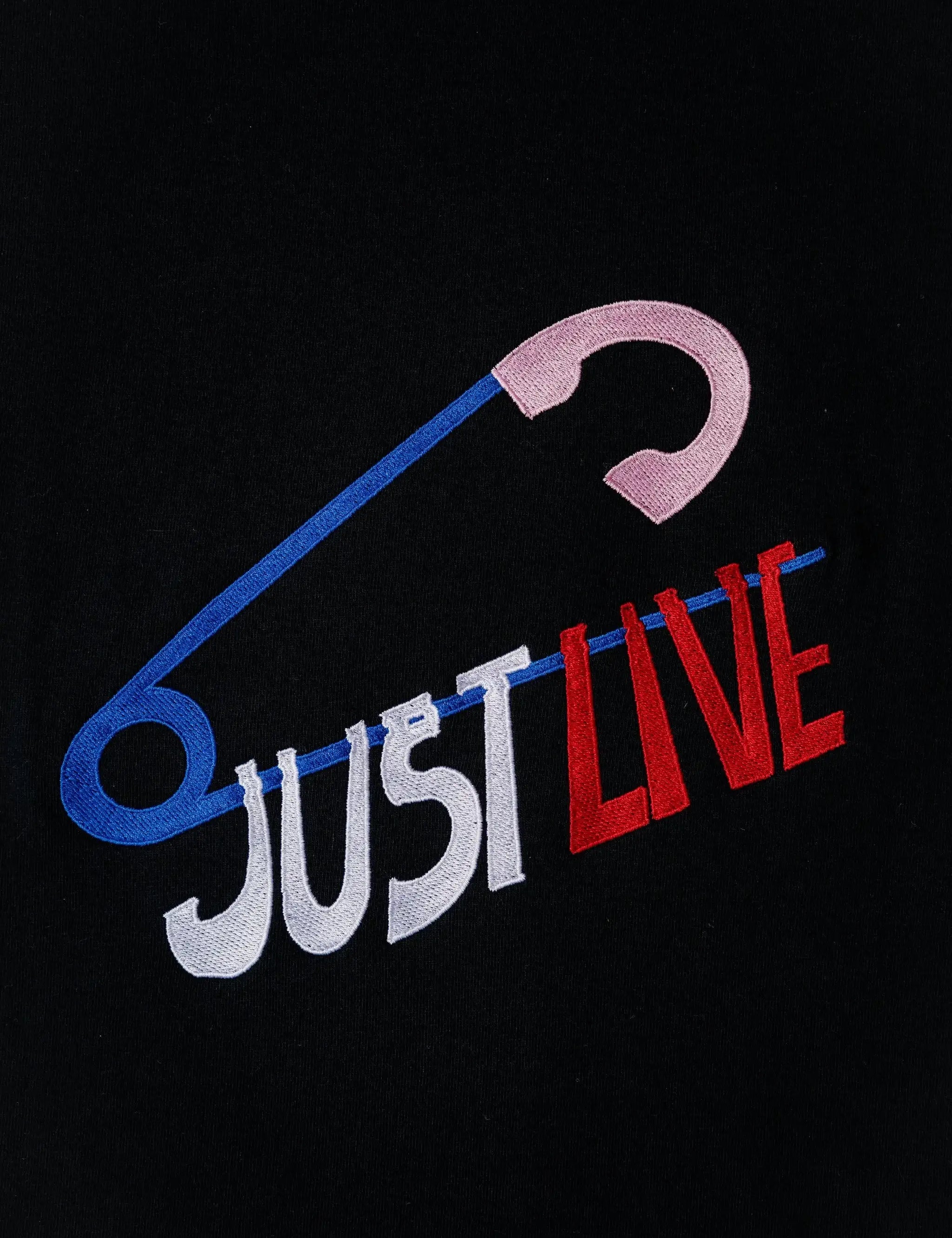 JustLive embroidered t-shirt by TURTLEGROOVE – embroidery close-up detail, black