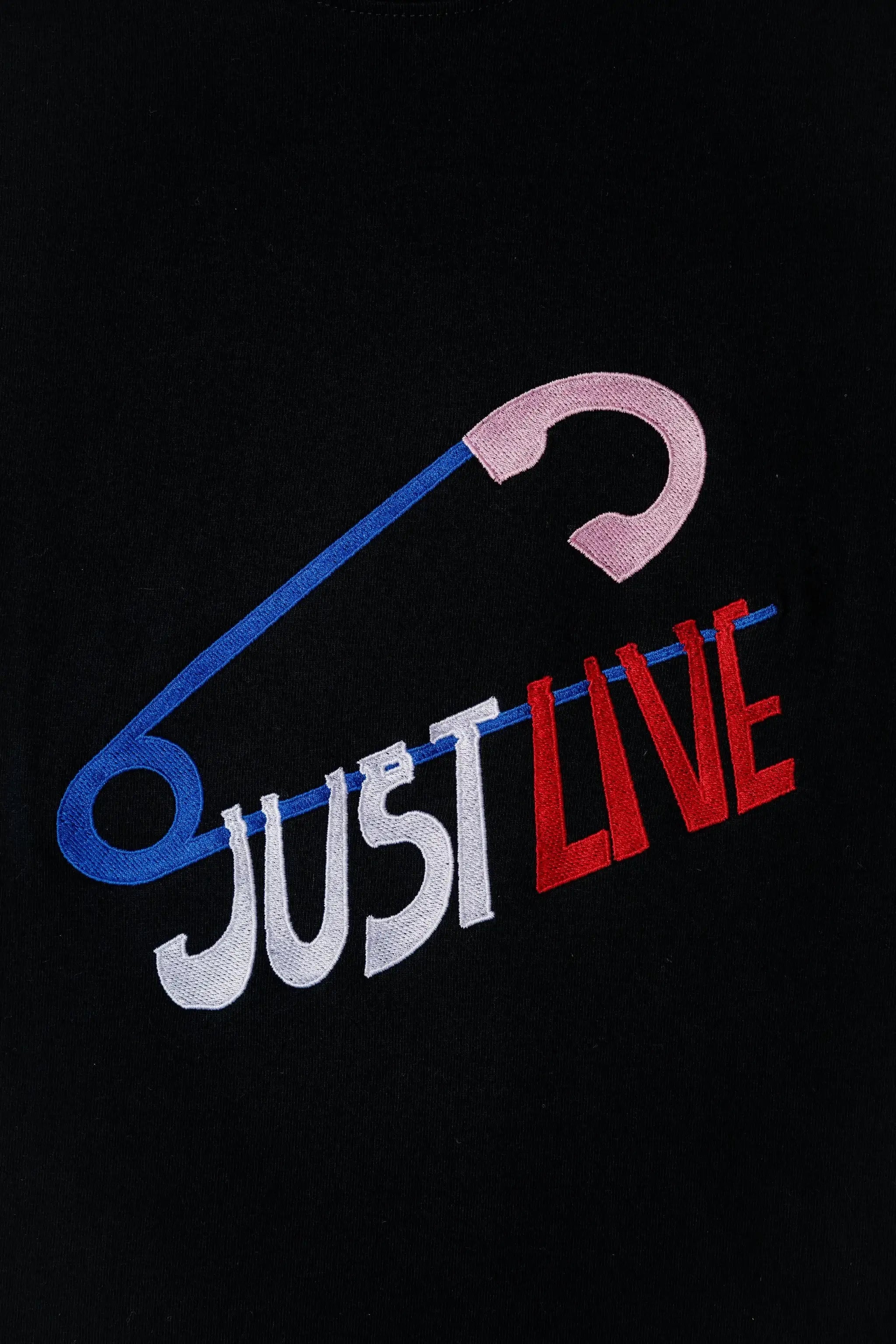 JustLive embroidered t-shirt by TURTLEGROOVE – embroidery close-up detail, black