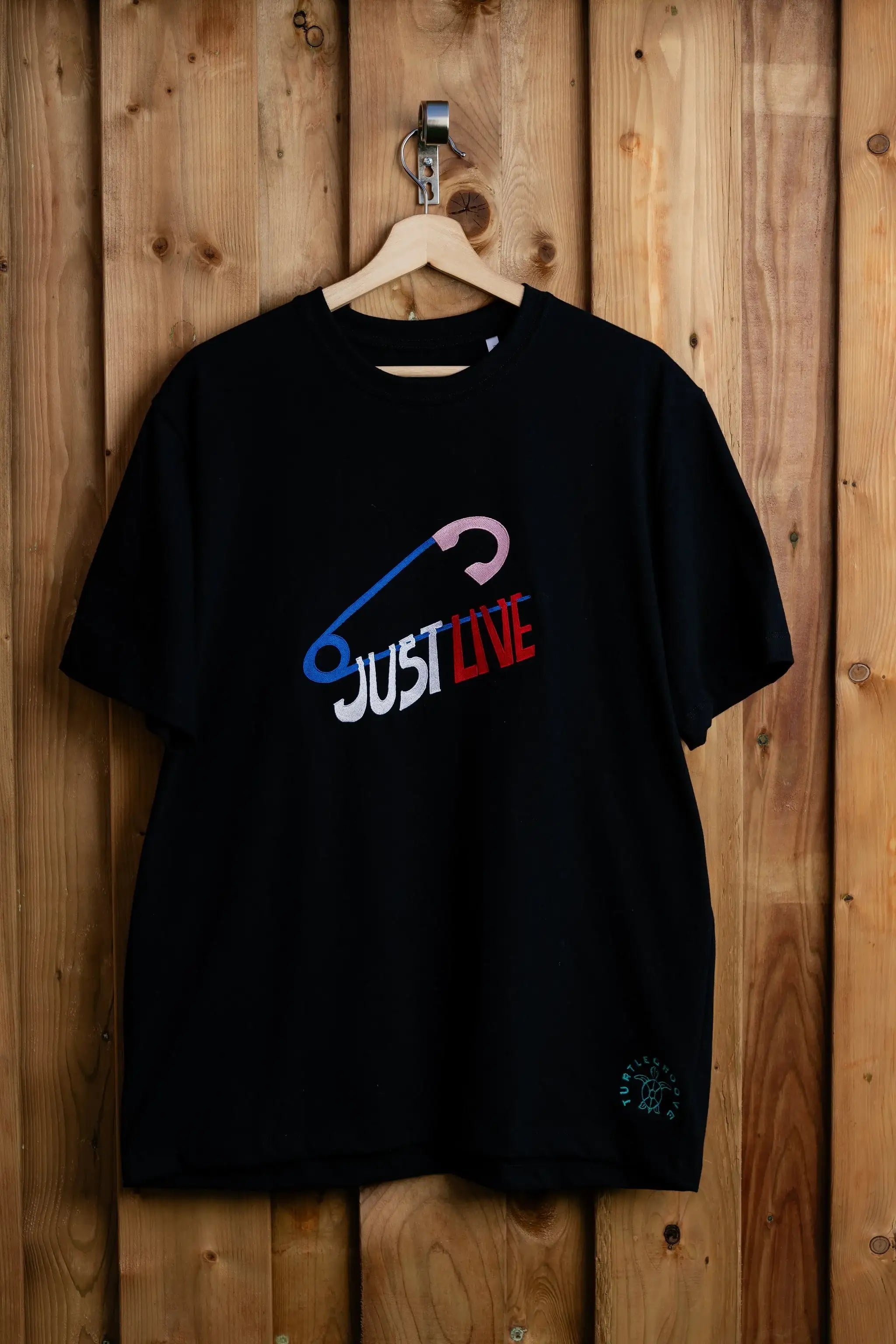 JustLive embroidered t-shirt by TURTLEGROOVE – front view, black
