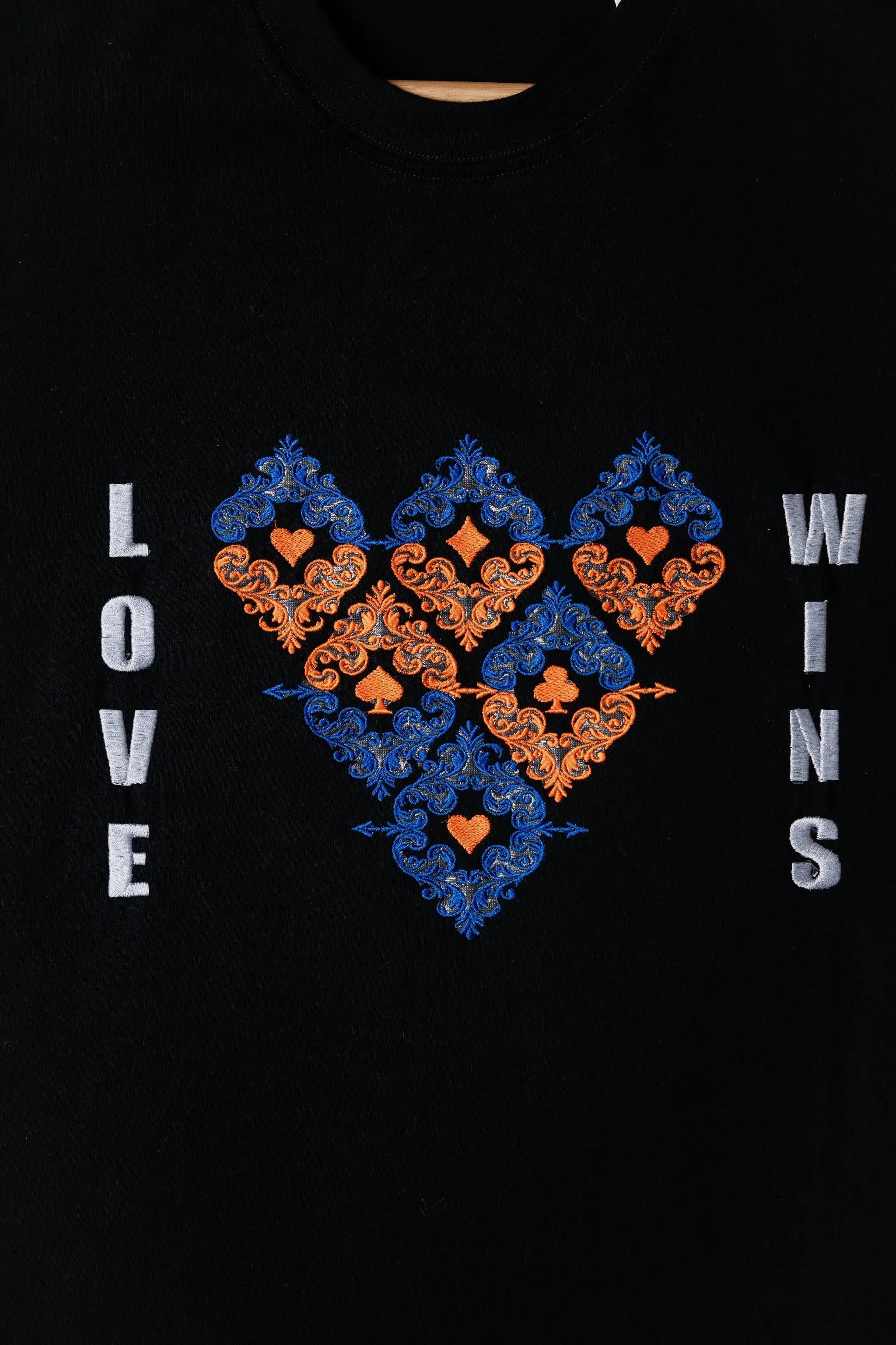 LoveWins embroidered t-shirt by TURTLEGROOVE – embroidery close-up detail, black