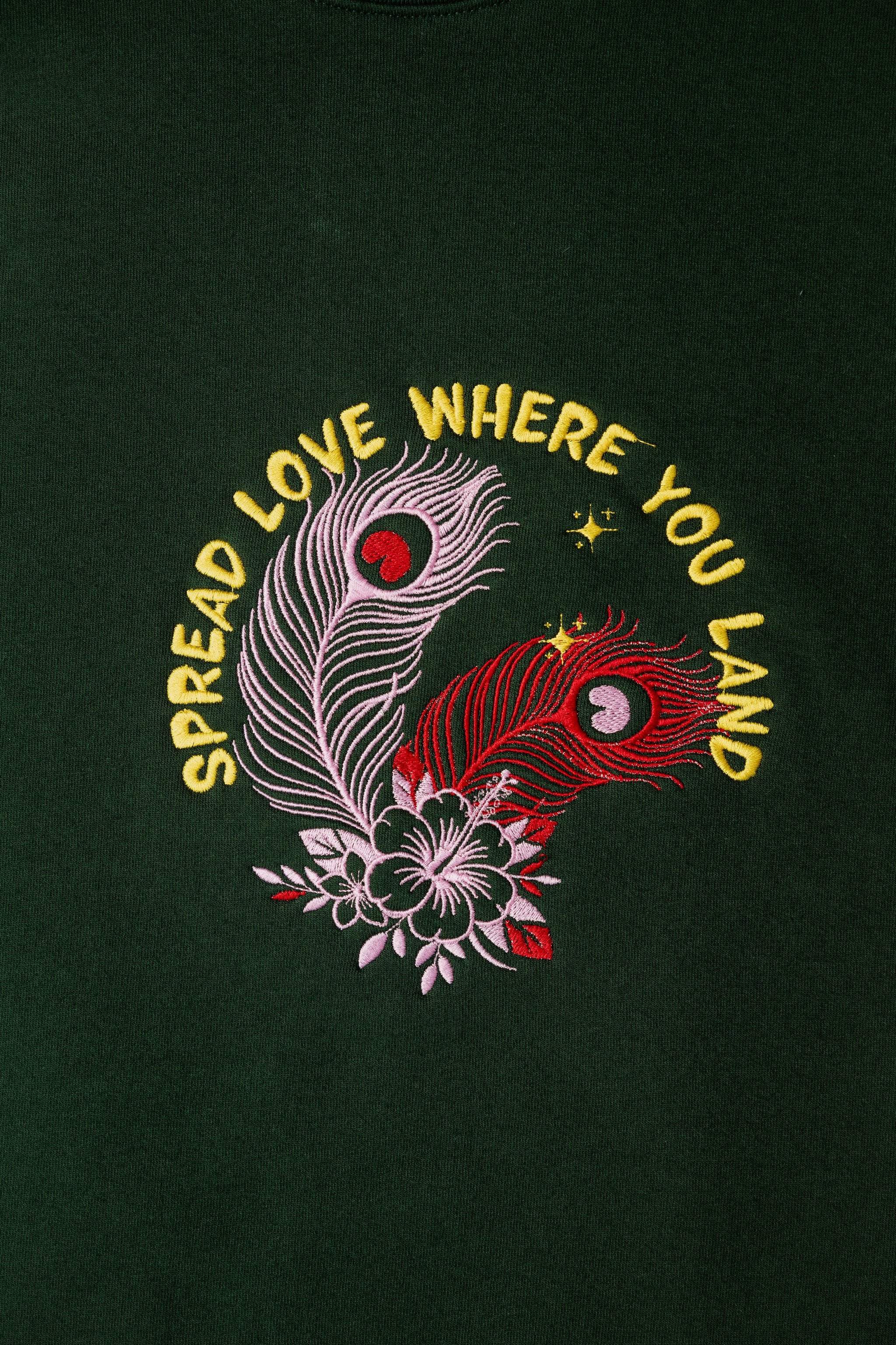 SpreadLove embroidered sweatshirt by TURTLEGROOVE – embroidery close-up detail, forest green