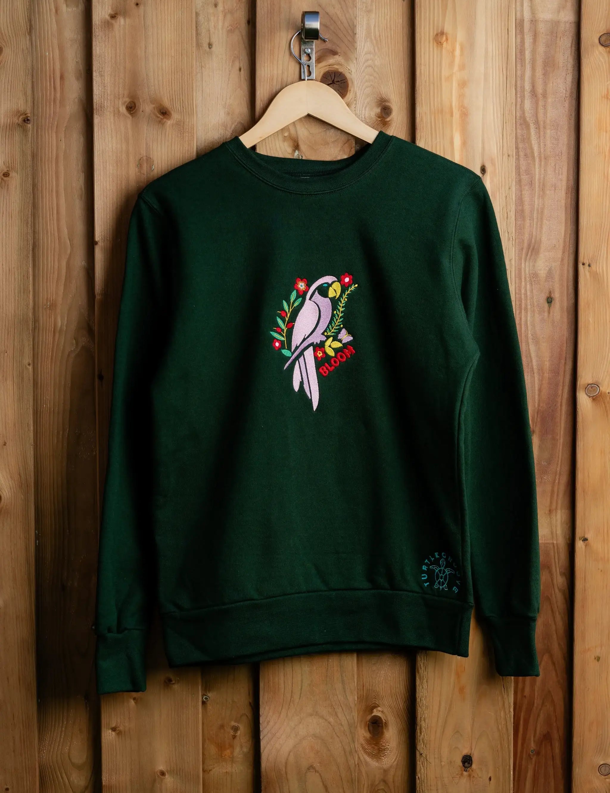 BloomParrot embroidered sweatshirt by TURTLEGROOVE – front view, forest green