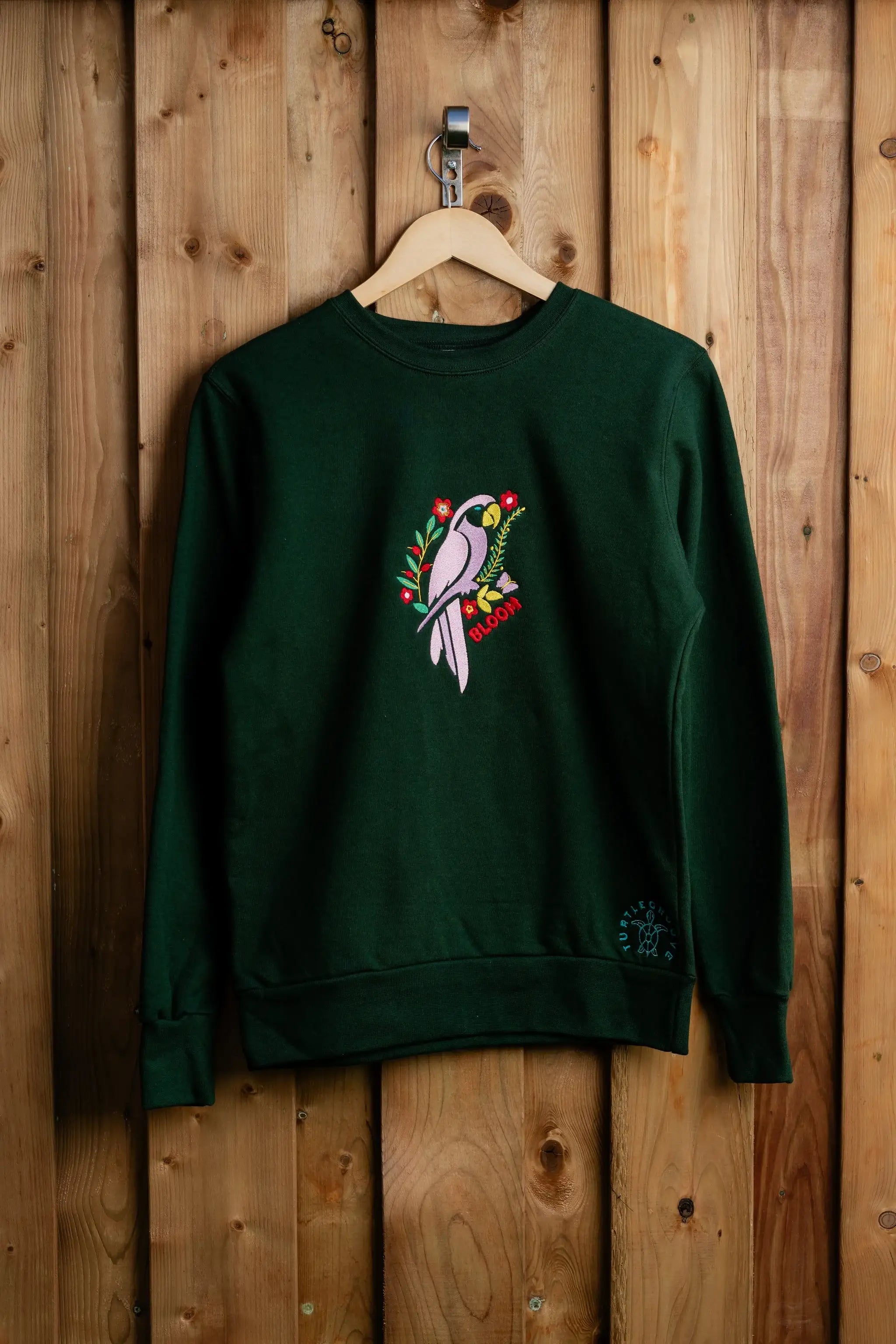 BloomParrot embroidered sweatshirt by TURTLEGROOVE – front view, forest green
