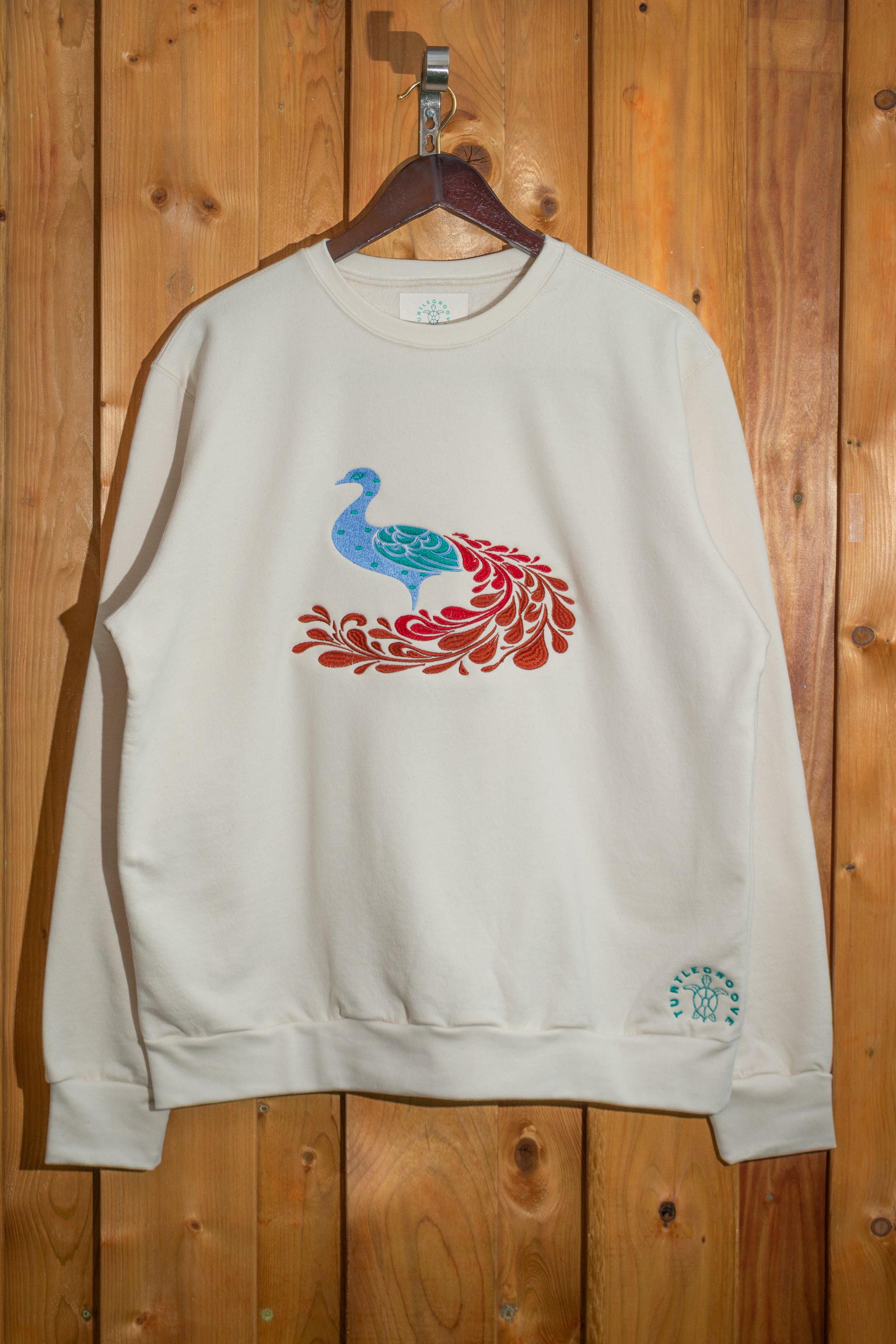 Peacock embroidered sweatshirt by TURTLEGROOVE – front view, Natural