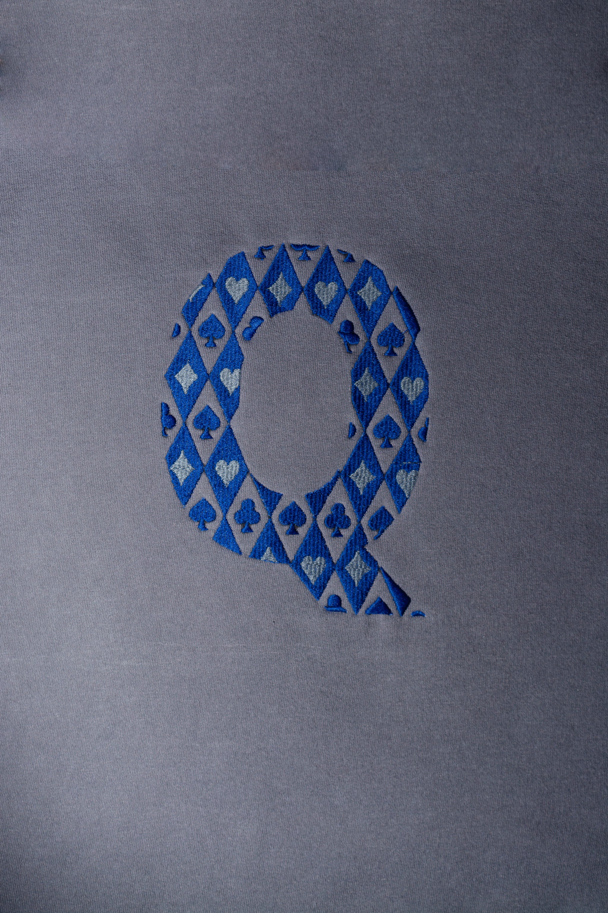Q embroidered sweatshirt by TURTLEGROOVE – embroidery close-up detail, Oil Grey