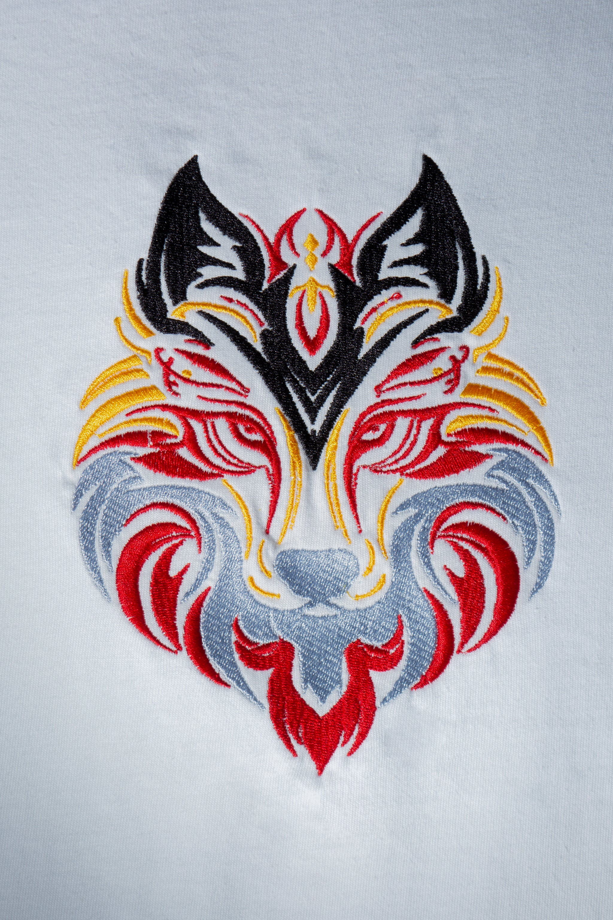 Flare Wolf embroidered t-shirt by TURTLEGROOVE – embroidery close-up detail, white
