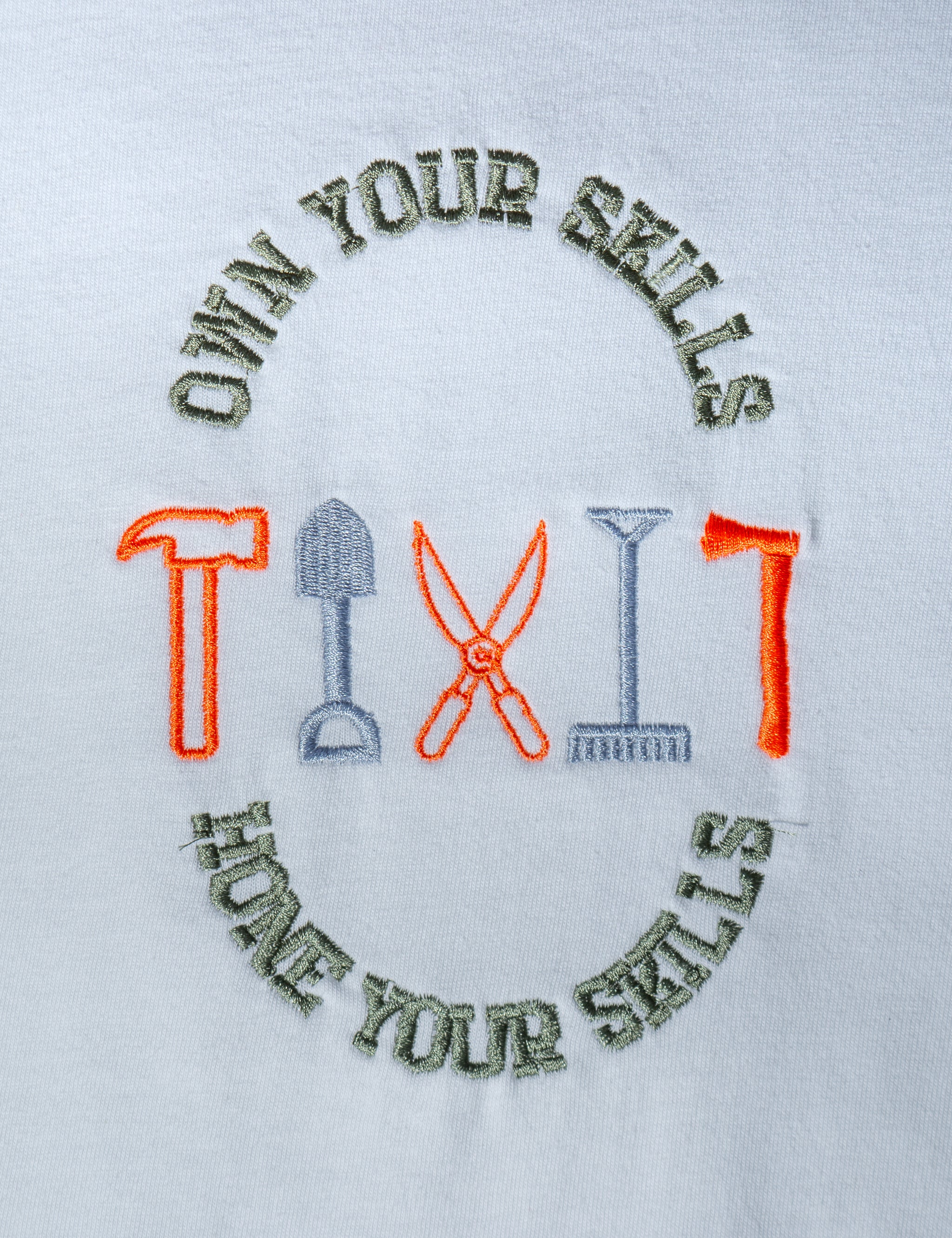Own Your Skills embroidered t-shirt by TURTLEGROOVE – embroidery close-up detail, white