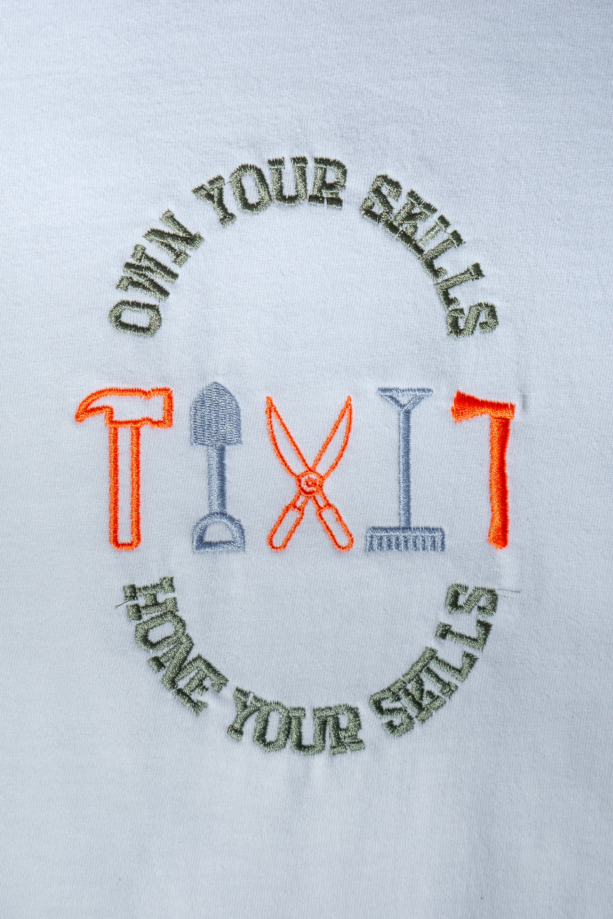 Own Your Skills embroidered t-shirt by TURTLEGROOVE – embroidery close-up detail, white